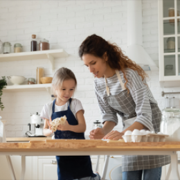 Mom and daughter baking in a kitchen