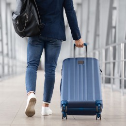 Person walking with a suitcase