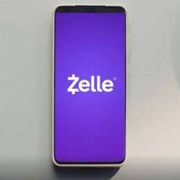 Cellphone with the Zelle logo